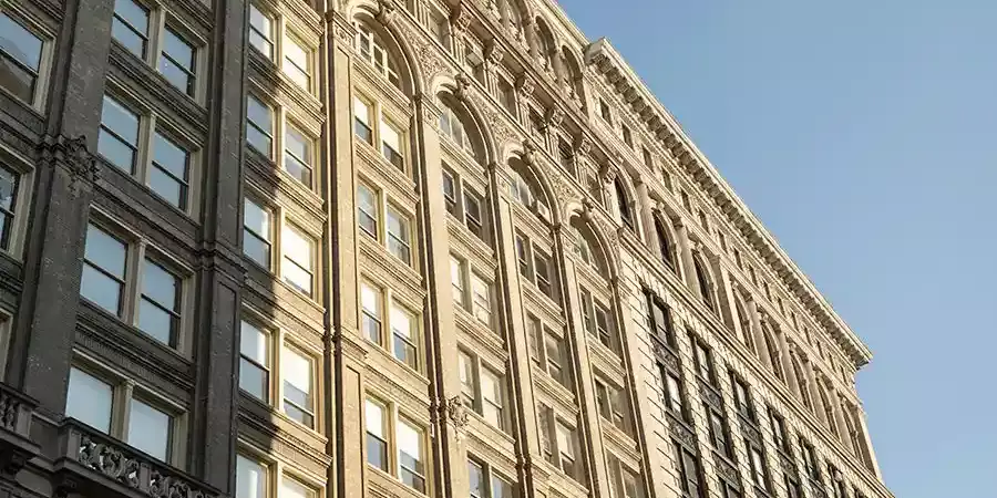 Historic high-rise office building for rent in New York City at 114 Crosby Street and Broadway, near Prince Street and Houston Street.